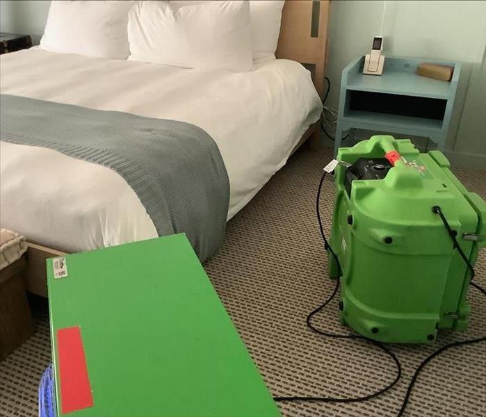 Air purification equipment is setup in a hotel room.